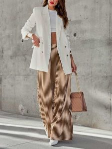 Milan Kiss Spodnie w kolorze kremowo-brązowym rozmiar: XL. Brązowe spodnie z wysokim stanem Milan Kiss, bez wzorów, z bawełny, z podwyższonym stanem. Za 165,99 zł.