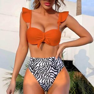 Strój kąpielowy z wysokim stanem modelujący brzuch plażowy Lidwina. Stroje jednoczęściowe Intica, bez wzorów, z materiału. Za 129,00 zł.