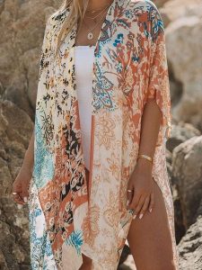 Milan Kiss Kimono w kolorze kremowym ze wzorem rozmiar: M. Białe swetry oversize Milan Kiss, m, bez wzorów, bez ramiączek. Za 144,92 zł.