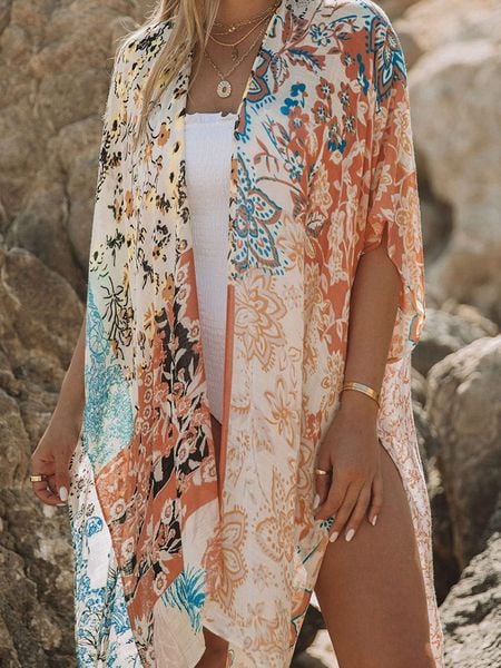 Milan Kiss Kimono w kolorze kremowym ze wzorem rozmiar: L. Białe swetry oversize Milan Kiss, l, bez wzorów, bez ramiączek. Za 130,81 zł.