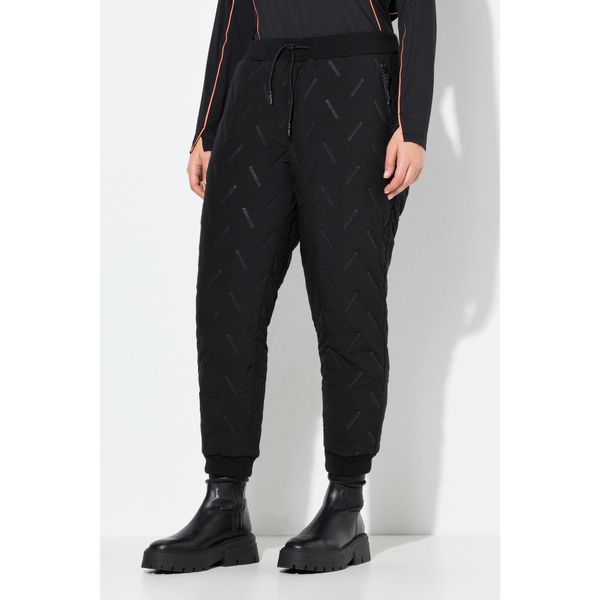 Damskie Funkcyjne spodnie dresowe kieszenie na zamek rąbek prążkowany stretch. Czarne spodnie dresowe Ulla Popken, plus size, bez wzorów, z dresówki. Za 349,99 zł.