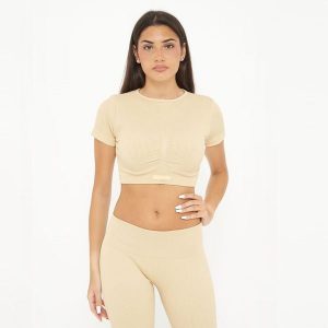Crop top treningowy damski WAY krótki rękaw. Brązowe topy LEGEA, bez wzorów, sportowe, bez kołnierzyka, bez ramiączek. W wyprzedaży za 68,00 zł.