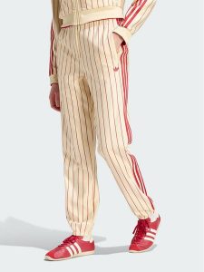 Adidas Spodnie dresowe 165364 Żółty Regular Fit. Żółte spodnie dresowe ADIDAS, l, bez wzorów, z dresówki. Za 399,99 zł.