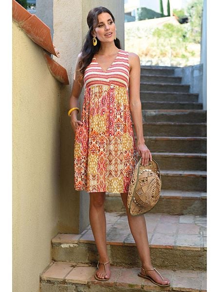 Bleu d'Azur Sukienka "Meribel" w kolorze jasnoróżowo-pomarańczowym rozmiar: 48. Pomarańczowe sukienki Bleu d'Azur, w ażurowe wzory, klasyczne, bez kołnierzyka, bez ramiączek, midi. Za 135,17 zł.