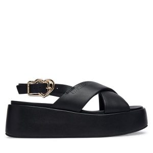 Sandały LOVE MOSCHINO. Czarne sandały LOVE MOSCHINO, bez wzorów, bez obcasa, na koturnie, bez zapięcia. Za 508,99 zł.