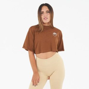 Crop top damski COSMIC LOVE brązowy. Brązowe topy LEGEA, bez wzorów, z bawełny, sportowe, bez kołnierzyka, bez ramiączek. Za 52,00 zł.