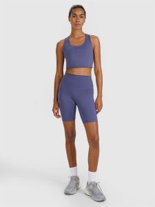 4F Legginsy kolarki treningowe damskie - granatowe M. Niebieskie legginsy 4f, bez wzorów, z dzianiny, z podwyższonym stanem, krótkie. Za 99,99 zł.