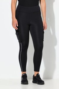Damskie Legginsy sportowe kieszenie cargo materiał Powerstretch. Czarne legginsy Ulla Popken, bez wzorów, z dresówki, z podwyższonym stanem. Za 279,99 zł.