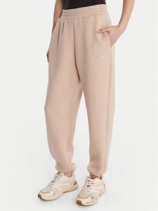 Guess Spodnie materiałowe 169841 Beżowy Slim Fit. Brązowe spodnie dresowe Guess, l, z aplikacjami, z dresówki. Za 349,99 zł.