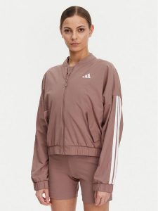 Adidas Kurtka bomber Essentials 3-Stripes JD5318 Różowy Loose Fit. Czerwone kurtki ADIDAS, l, bez wzorów, z syntetyku, bez kaptura. W wyprzedaży za 189,99 zł.