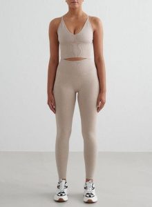 Damskie legginsy invisible scrunch, squat proof Shape Seamless beżowy melanż. Brązowe legginsy AIM'N, bez wzorów, z dzianiny, z podwyższonym stanem. Za 296,00 zł.