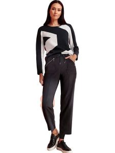 Heine Spodnie dresowe w kolorze czarnym rozmiar: 40. Czarne spodnie dresowe Heine, bez wzorów, z dresówki. Za 109,52 zł.