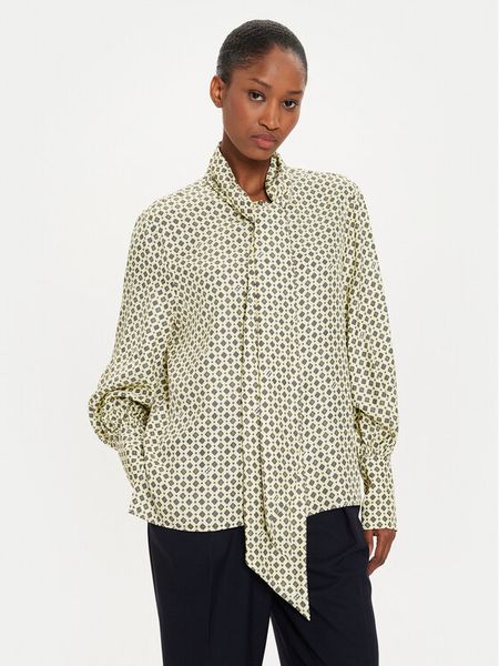 Tommy Hilfiger Bluzka WW0WW42294 Żółty Relaxed Fit. Żółte bluzki TOMMY HILFIGER, bez wzorów, z wiskozy, bez kołnierzyka, bez ramiączek. Za 309,99 zł.