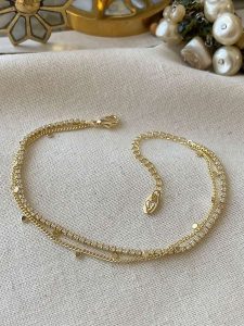 Luseera Pozłacana bransoletka z elementami ozdobnymi rozmiar: onesize. Żółte bransoletki Luseera, z cyrkonią, pozłacane. Za 43,99 zł.