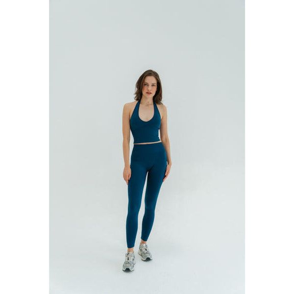 Legginsy modelujące do jogi Moonholi Malibu Evenings z wysokim stanem. Niebieskie legginsy MOONHOLI, bez wzorów, z podwyższonym stanem. Za 359,00 zł.