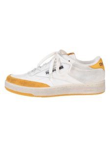 Reebok Skórzane sneakersy "Club C Revenge" w kolorze biało-żółtym rozmiar: 42. Białe trampki Reebok, bez wzorów, bez zapięcia. Za 284,95 zł.