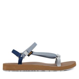 Sandały Teva. Niebieskie sandały Teva, bez wzorów, bez obcasa, na płaskiej podeszwie, bez zapięcia. Za 299,99 zł.