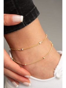 Heliophilia Pozłacana bransoletka z cyrkoniami na kostkę rozmiar: onesize. Czerwone bransoletki Heliophilia, z cyrkonią, metalowe. Za 21,95 zł.