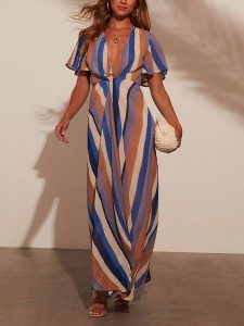 Milan Kiss Sukienka w kolorze jasnobrązowo-niebiesko-beżowym rozmiar: XL. Brązowe sukienki Milan Kiss, xl, bez wzorów, z wiskozy, bez kołnierzyka, bez ramiączek, maxi. Za 173,99 zł.