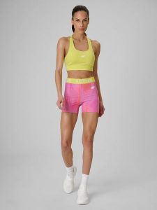 4F Legginsy krótkie treningowe damskie - koralowe S. Pomarańczowe legginsy 4f, bez wzorów, z materiału, z podwyższonym stanem, krótkie. Za 99,99 zł.