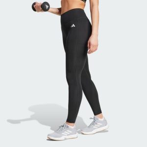 Długie legginsy Optimé Essentials Stash Pocket. Czarne legginsy ADIDAS, bez wzorów, z elastanu, z podwyższonym stanem, długie. Za 157,99 zł.