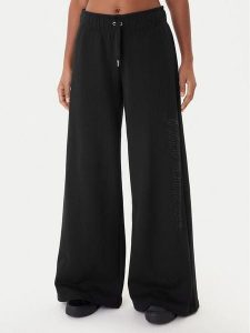 Juicy Couture Spodnie dresowe Annen JCWBJ225320 Czarny Wide Leg. Czarne spodnie dresowe Juicy Couture, m, bez wzorów, z bawełny. Za 349,99 zł.