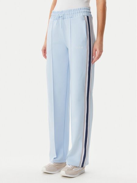 Guess Spodnie dresowe V5GB12 KCRU2 Błękitny Regular Fit. Niebieskie spodnie dresowe Guess, xs, z aplikacjami, z dresówki. Za 259,99 zł.