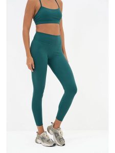 Onamaste Legginsy sportowe "Geneva" w kolorze turkusowym rozmiar: S/M. Niebieskie legginsy Onamaste, m, bez wzorów, z materiału, outdoorowe. Za 96,37 zł.