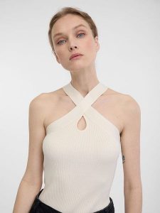 Orsay Top w kolorze kremowym rozmiar: XL. Brązowe topy Orsay, xl, bez wzorów, bez kołnierzyka, bez ramiączek. Za 34,99 zł.