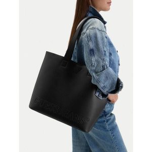 Torebka Guess Jeans. Czarne shopper bag Guess Jeans, z aplikacjami, z jeansu, bez dodatków. Za 249,99 zł.