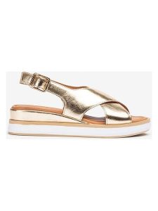 Unisa Skórzane sandały w kolorze złotym na koturnie rozmiar: 38. Żółte sandały Unisa, bez wzorów, z otwartym noskiem, bez obcasa, na koturnie, bez zapięcia. Za 173,99 zł.