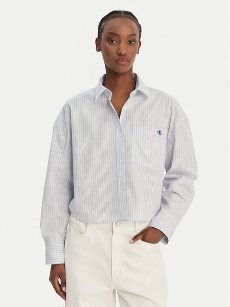 Calvin Klein Jeans Koszula LV047F105G Błękitny Relaxed Fit. Niebieskie koszule Calvin Klein Jeans, s, bez wzorów, z bawełny, bez kołnierzyka, bez ramiączek. Za 409,99 zł.