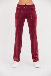 JUICY COUTURE Bordowe spodnie dresowe Del Ray Pocket Pant. Czerwone spodnie dresowe Juicy Couture, s, bez wzorów, z dresówki. W wyprzedaży za 362,99 zł.