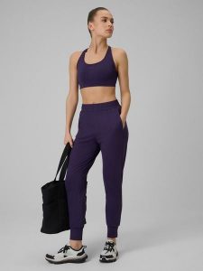 4F Spodnie treningowe szybkoschnące damskie - fioletowe L. Fioletowe spodnie dresowe 4f, l, bez wzorów. Za 179,99 zł.