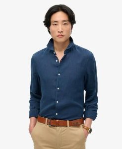 Superdry Koszula lniana Vacation z długim rękawem – NAVY. Niebieskie koszule Superdry, xl, bez wzorów, ze lnu, bez kołnierzyka, bez ramiączek. Za 317,00 zł.