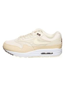 Nike Skórzane sneakersy "Air Max 1 '87" w kolorze kremowo-beżowym rozmiar: 38. Brązowe trampki Nike, bez wzorów, bez zapięcia. Za 461,21 zł.