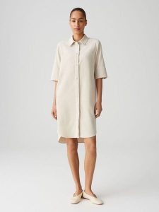 OPUS Sukienka "Winchesta" w kolorze kremowym rozmiar: 36. Brązowe sukienki Opus, bez wzorów, bez kołnierzyka, bez ramiączek, midi. Za 220,63 zł.