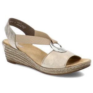 Złote Sandały Rieker Eleganckie Buty Damskie. Żółte sandały Rieker, bez wzorów, z materiału, bez obcasa, na koturnie, bez zapięcia. Za 239,00 zł.
