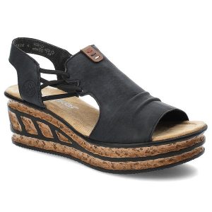 Granatowe Sandały Rieker Modne Obuwie Damskie. Niebieskie sandały Rieker, bez wzorów, ze skóry ekologicznej, bez obcasa, na koturnie, bez zapięcia. Za 319,00 zł.