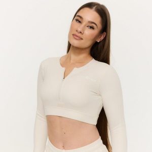Top damski fitness z zamkiem Prime. Białe topy GYMBEAM, m, bez wzorów, z elastanu, bez kołnierzyka, bez ramiączek. Za 106,90 zł.