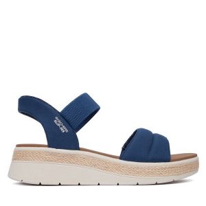 Sandały Skechers. Niebieskie sandały Skechers, bez wzorów, bez obcasa, na płaskiej podeszwie, bez zapięcia. Za 289,99 zł.