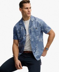 Superdry Krótki rękaw koszula plażowa z nadrukiem bawełna-len. Niebieskie koszule Superdry, xl, bez wzorów, z bawełny, bez kołnierzyka, bez ramiączek. Za 301,95 zł.