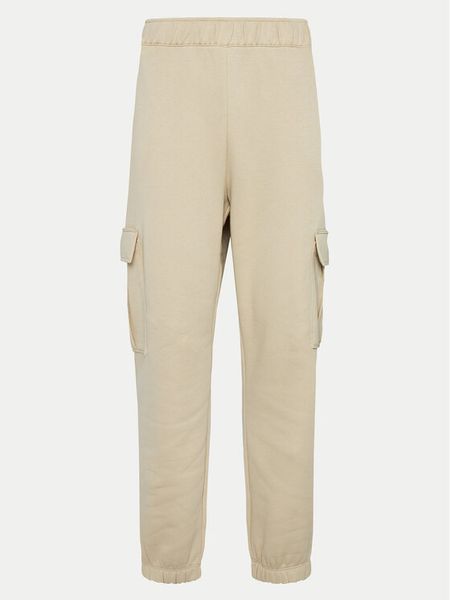 Champion Spodnie dresowe 117554 Beżowy Loose Fit. Brązowe spodnie dresowe Champion, xl, bez wzorów, z bawełny. Za 129,99 zł.
