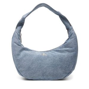Torebka Calvin Klein. Niebieskie torebki klasyczne Calvin Klein, bez wzorów, z denimu, bez dodatków. Za 289,99 zł.