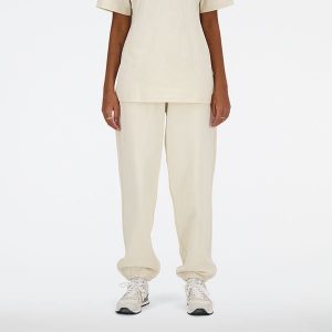 Spodnie damskie New Balance WP41513LIN – beżowe. Brązowe spodnie z wysokim stanem New Balance, bez wzorów, z bawełny, z podwyższonym stanem. Za 379,99 zł.