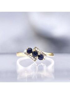 CARATELLI Złoty pierścionek "Melbourne" z diamentami i szafirami rozmiar: 50. Niebieskie pierścionki CARATELLI, z diamentem, złote. Za 1 148,95 zł.