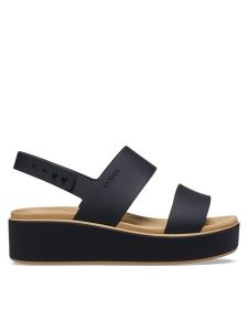 Crocs Sandały Brooklyn Matte Wrap Low Wedge 211802 Czarny. Czarne sandały Crocs, bez wzorów, z tworzywa sztucznego, bez obcasa, na płaskiej podeszwie, bez zapięcia. Za 259,99 zł.