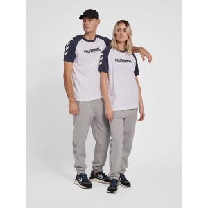Koszulka Hummel Legacy Blocked. Białe bluzki Hummel, bez wzorów, z bawełny, sportowe, bez kołnierzyka, bez ramiączek. Za 130,50 zł.