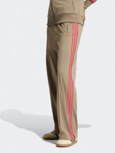 Adidas Spodnie dresowe w kolorze beżowym rozmiar: M. Brązowe spodnie dresowe ADIDAS, m, bez wzorów, z dresówki. Za 209,95 zł.
