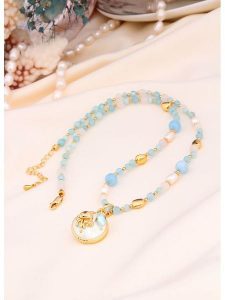 L'Atelier de Gaia Pozłacany naszyjnik perłami i opalami - dł. 50 cm rozmiar: onesize. Białe naszyjniki L'Atelier de Gaia, z opalem, pozłacane. Za 183,15 zł.